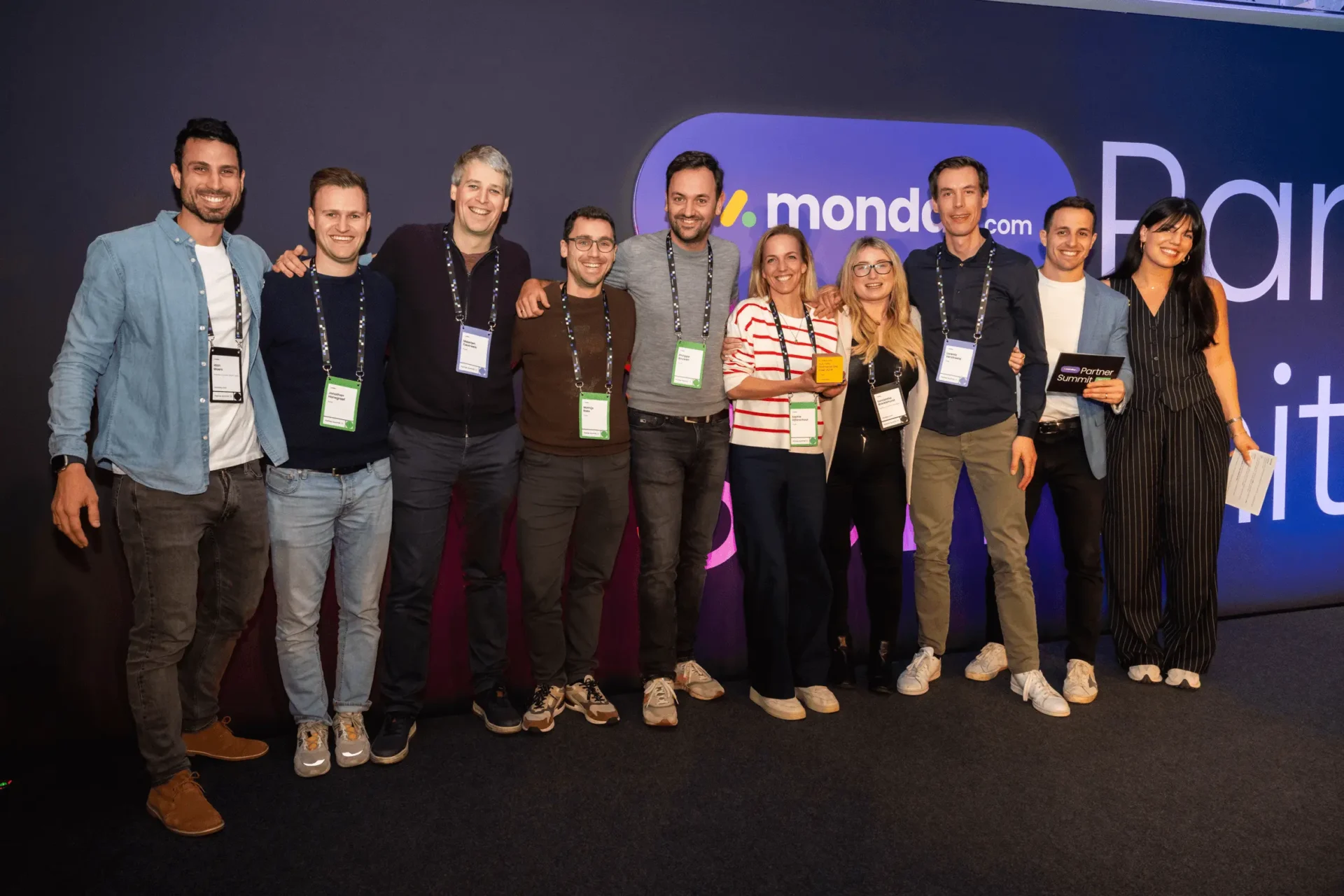 Group photo of 10 Tryve and monday.com colleagues at the 2025 Partner Summit in London, celebrating after winning Global Customer Success Partner of the Year.